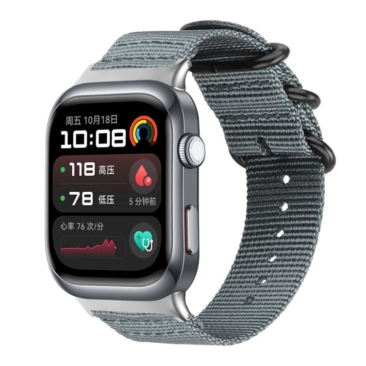 Gray nylon canvas watch band with black ring buckle on a silver smartwatch with dark display