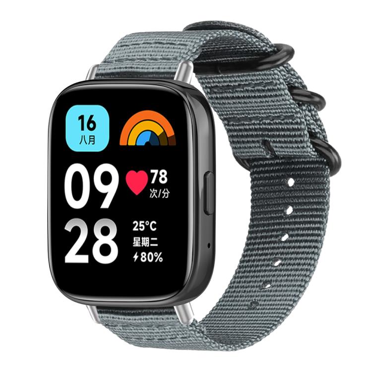 Gray nylon canvas watch band with black ring buckle on a rectangular watch