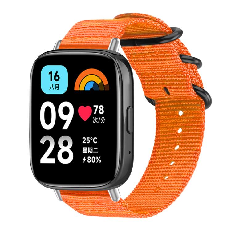 Orange nylon canvas smartwatch band with black ring buckle, shown attached to a watch