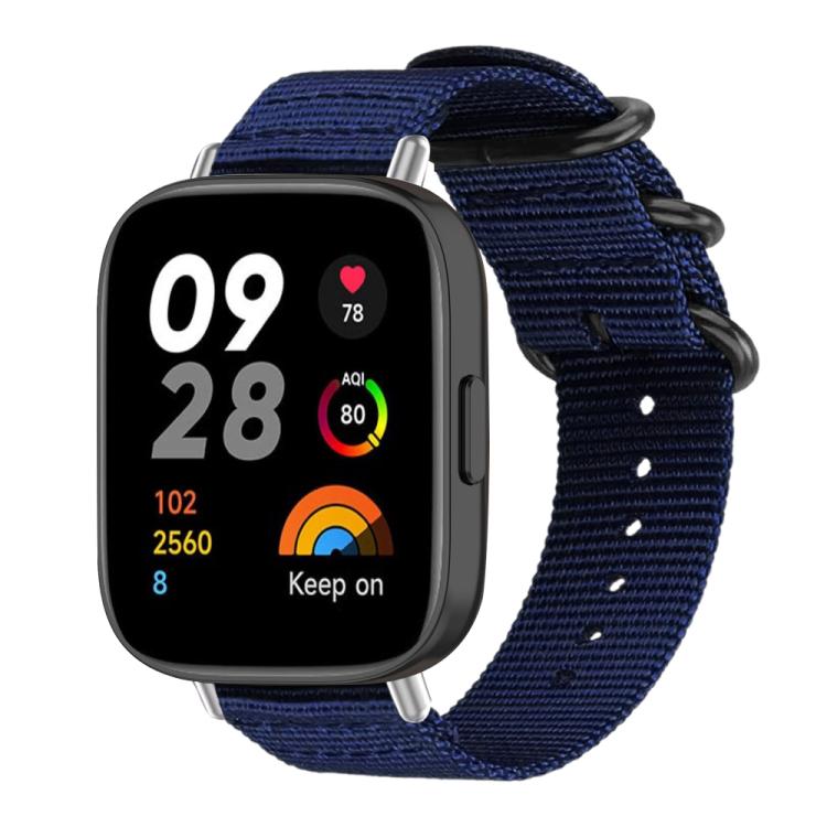 Midnight blue nylon canvas smartwatch band with black ring buckle, shown attached to a watch