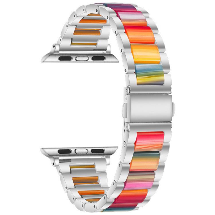 Silver metal and resin Apple Watch band with rainbow-colored links, shown alone