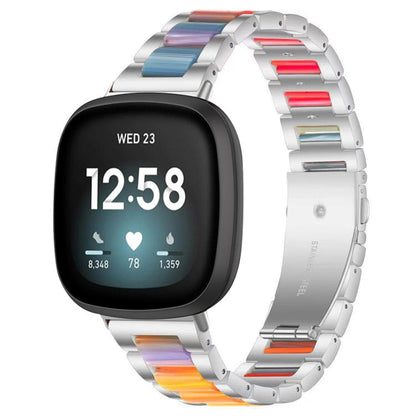 xDfind silver metal and resin watch band with rainbow-colored links, shown on a smartwatch