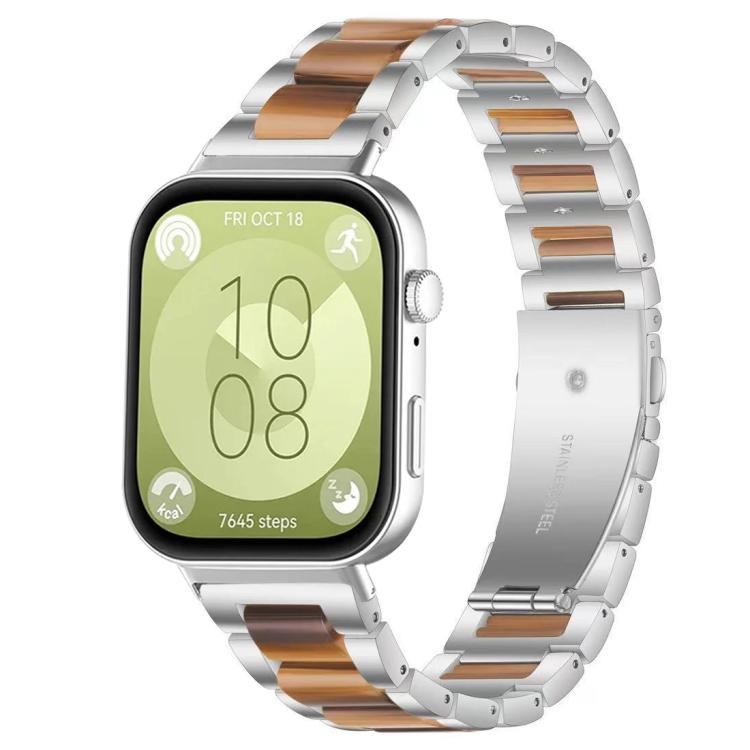 Silver metal watch band with brown resin links and three-bead accents