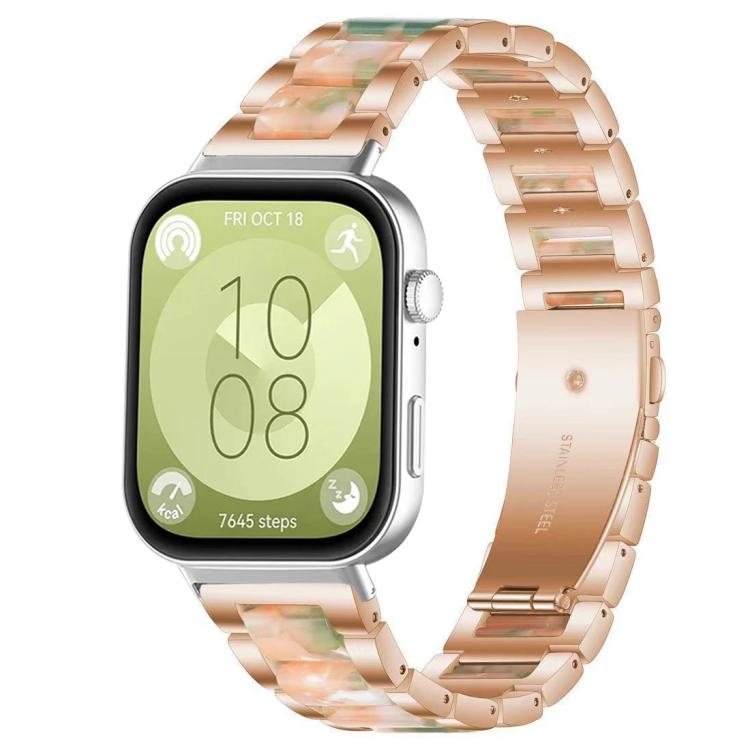 Rose gold metal watch band with green and peach resin links and three-bead accents