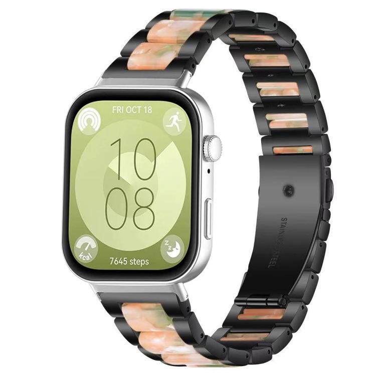 Black metal watch band with green and peach resin links, shown on a smartwatch.