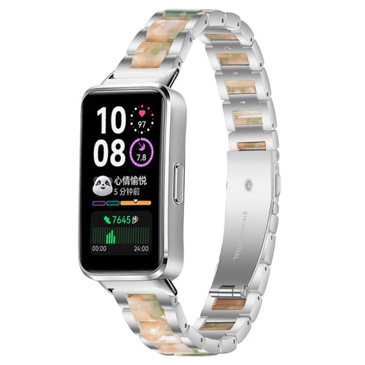 Silver metal watch band with green and peach resin links, shown on a smartwatch.