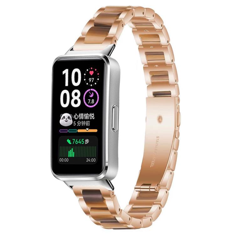 Rose gold watch with a metal band featuring brown resin links
