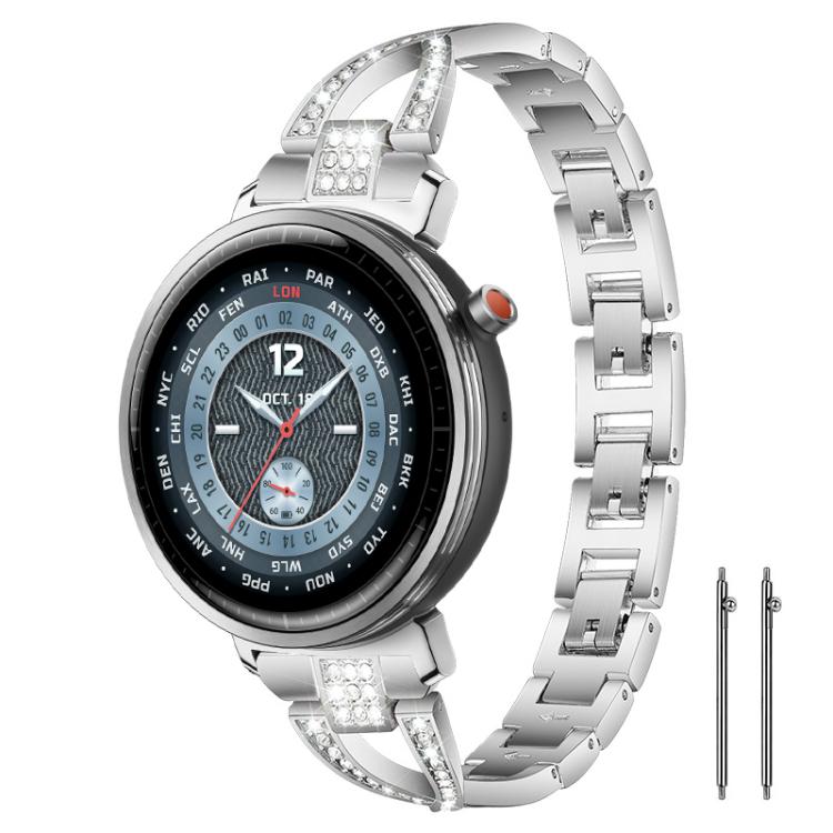 Silver X-shaped metal watch band with crystal accents, shown on a round watch