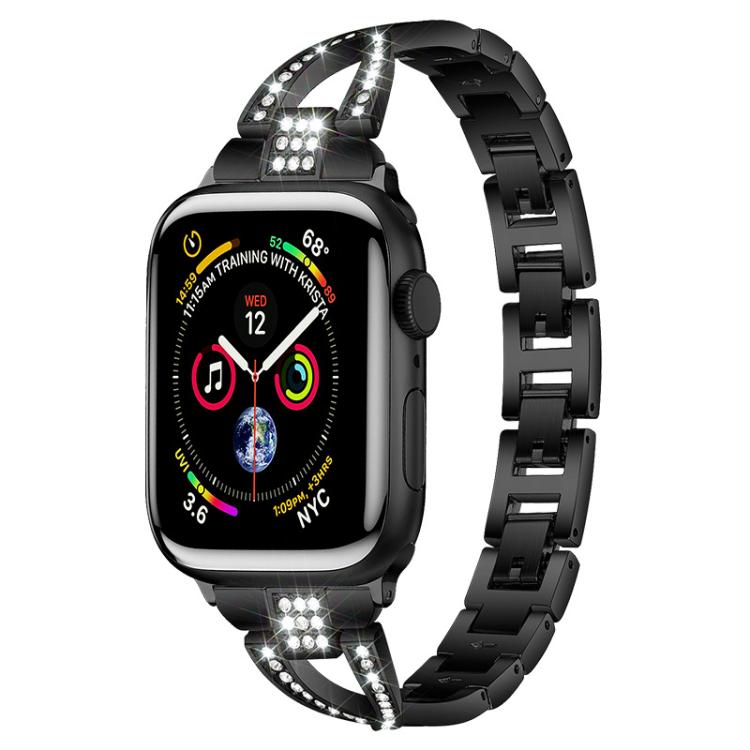 Black X-shaped metal Apple Watch band with crystal accents, shown attached to a watch