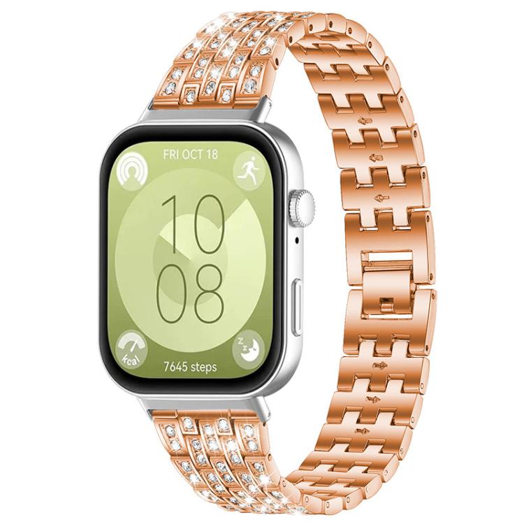 Rose gold metal smartwatch band with five rows of clear stones, shown on a smartwatch.