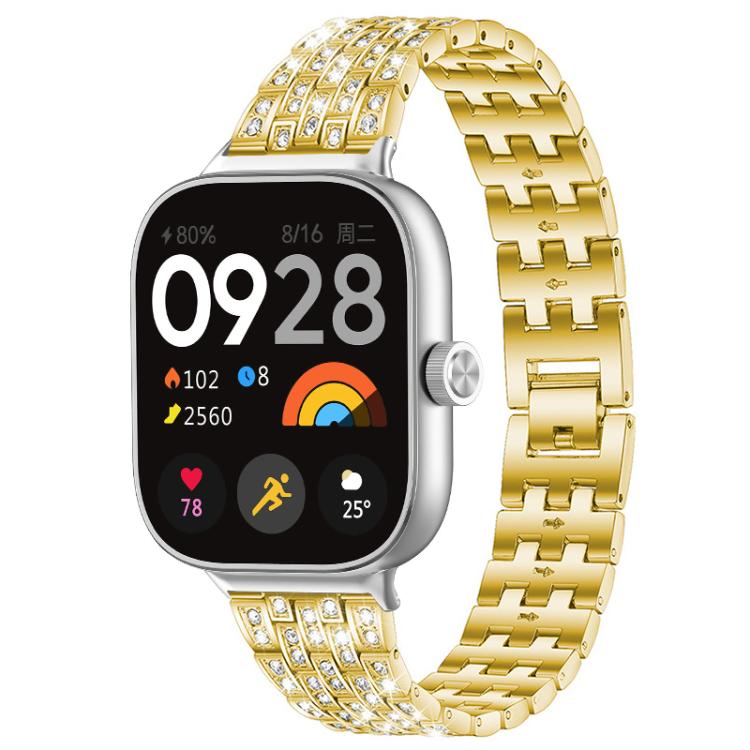 Gold metal smartwatch band with rows of clear stones and a linked bracelet.