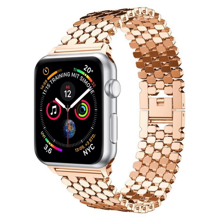 Rose gold fish scale metal Apple Watch band shown attached to a watch