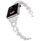 Silver linked stainless steel Apple Watch band with crystal accents, shown at an angle