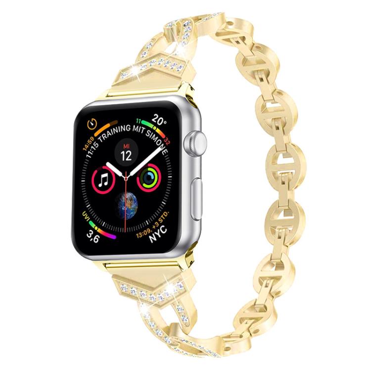 Gold crystal-accented stainless steel band attached to an Apple Watch