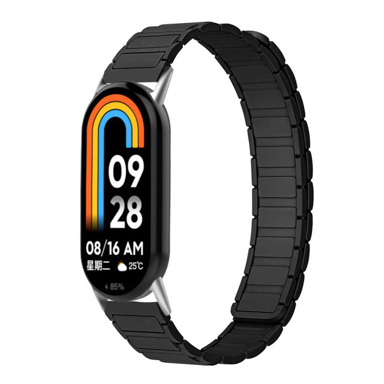 Black silicone watch band shown on a smart band.