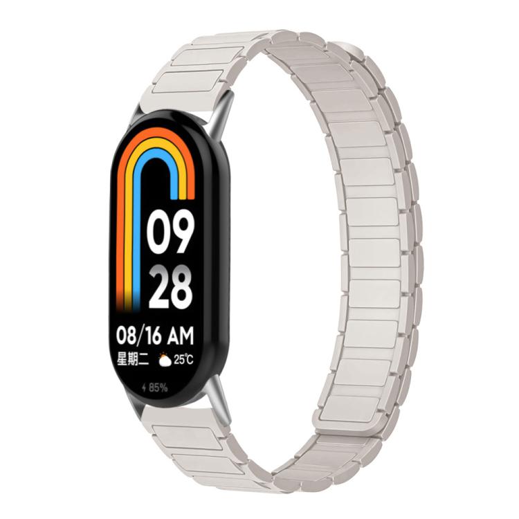 Pale starlight silicone watch band shown on a smart band.