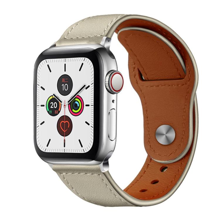 Beige leather Apple Watch band with brown lining and a metal rivet buckle