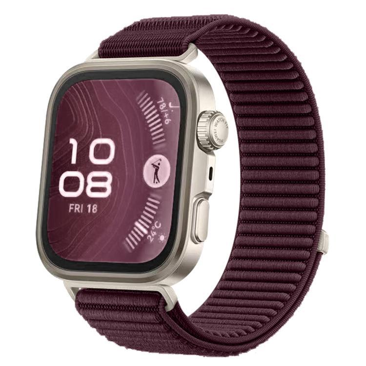 Woven nylon watch band in dark plum with a silver smartwatch