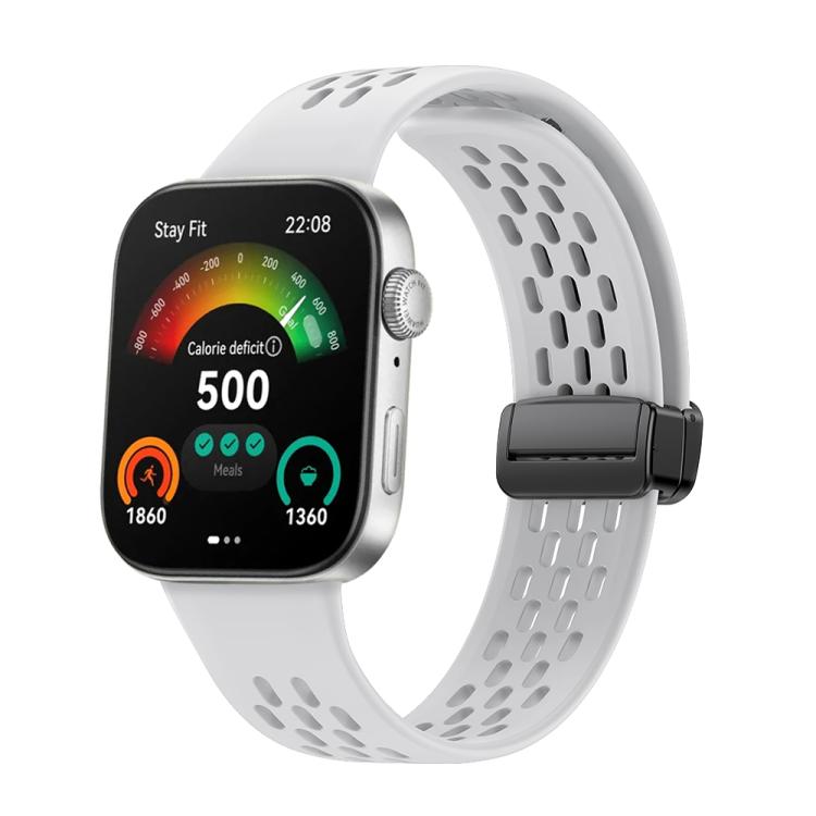 White perforated silicone watch band with black magnetic clasp on a smartwatch