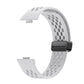 White perforated silicone watch band with a black magnetic buckle, shown without a watch