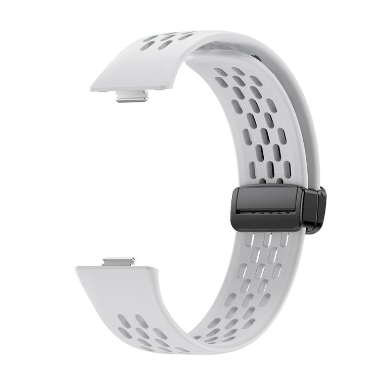 White perforated silicone watch band with a black magnetic buckle, shown without a watch