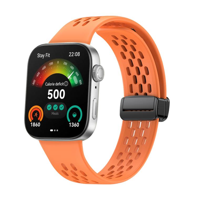 Orange perforated silicone watch band with a black magnetic buckle, attached to a smartwatch