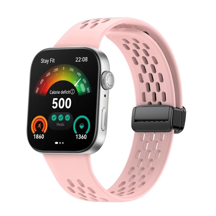 Pink perforated silicone watch band with a black magnetic buckle, attached to a smartwatch