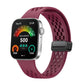 Wine red perforated silicone watch band with a black magnetic buckle, attached to a smartwatch