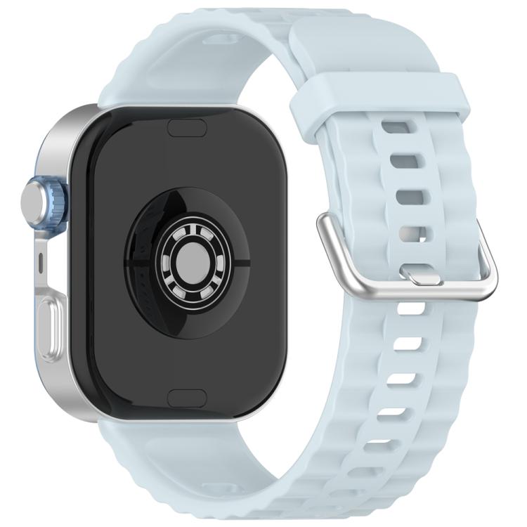 Light blue silicone watch band with silver buckle, shown attached to a smartwatch