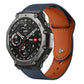 Leather watch band with dark blue exterior, orange-brown lining, and rivet buckle
