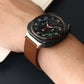 Brown leather watch band shown worn on a wrist with a round smartwatch.