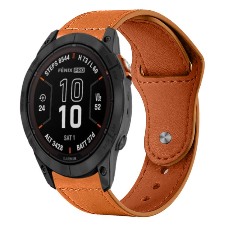 Tan leather watch band with stitching and metal rivet buckle