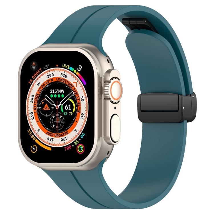 xDfind teal silicone Apple Watch band with black folding buckle, shown on a watch