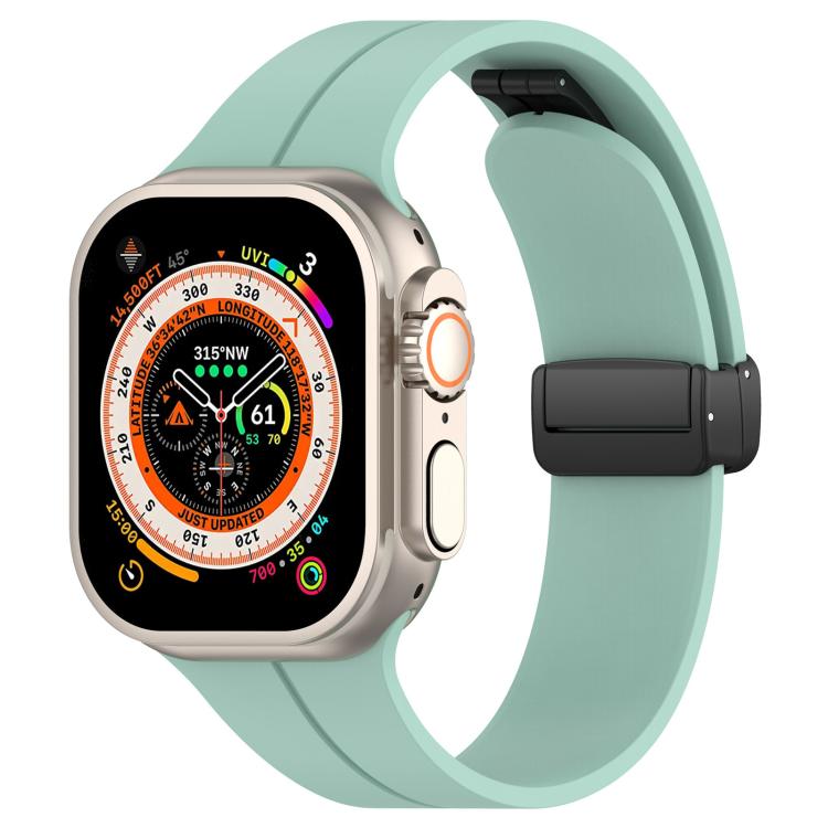 xDfind mint green silicone Apple Watch band with black folding buckle, shown on a watch