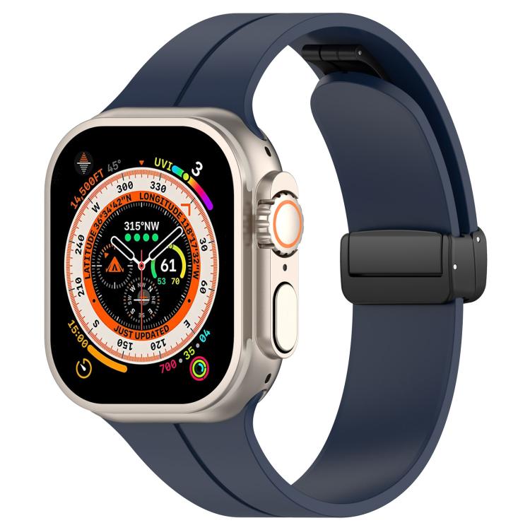 Dark blue silicone watch band with black folding buckle, shown on an Apple Watch