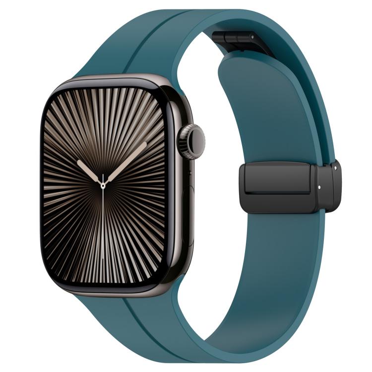 Teal silicone watch band with black folding buckle, shown on an Apple Watch