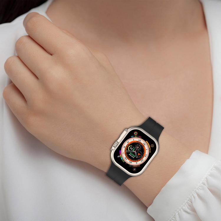 xDfind black silicone Apple Watch band worn on a wrist