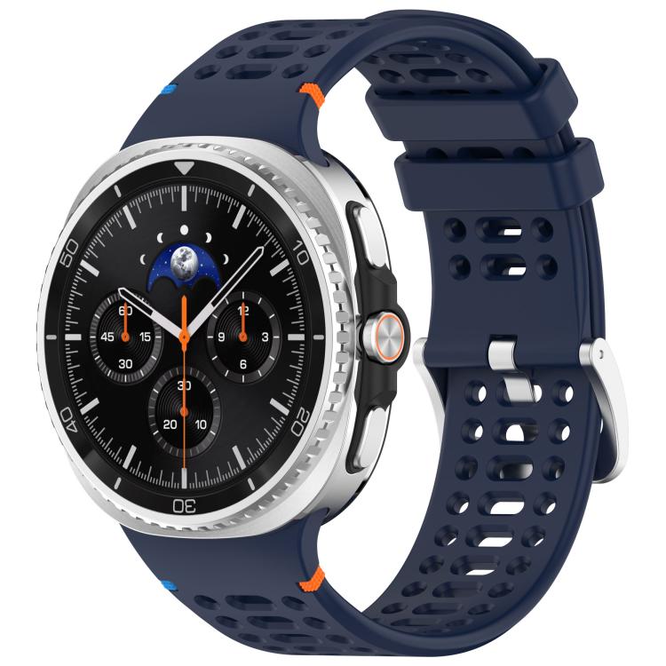 Midnight blue perforated silicone watch band with silver buckle, shown on a silver smartwatch