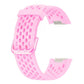 Pink perforated silicone watch band for Fitbit Charge 6/5, shown without tracker