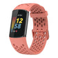 Coral perforated silicone watch band fitted to a Fitbit Charge 6/5 tracker