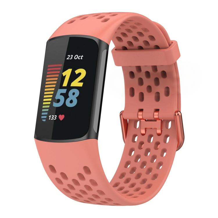 Coral perforated silicone watch band fitted to a Fitbit Charge 6/5 tracker