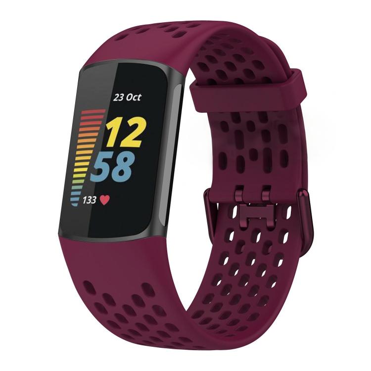 Burgundy perforated silicone watch band fitted to a Fitbit Charge 6/5 tracker