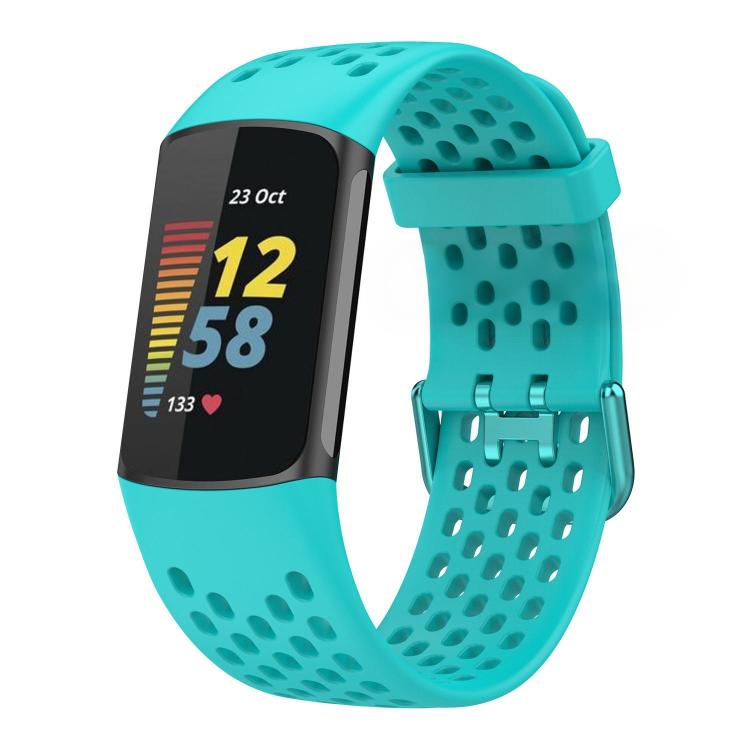 Turquoise perforated silicone watch band fitted to a Fitbit Charge 6/5 tracker