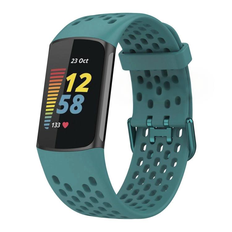 Teal perforated silicone watch band fitted to a Fitbit Charge 6/5 tracker