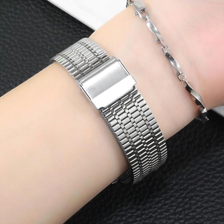 Silver stainless steel watch band with a multi-row link design, worn on a wrist.