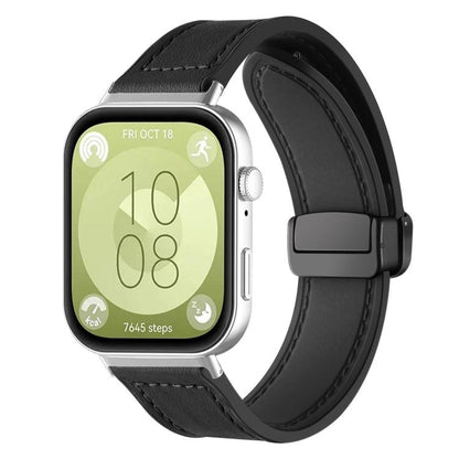 Black silicone watch band with stitched panels and magnetic buckle, shown on a smartwatch.
