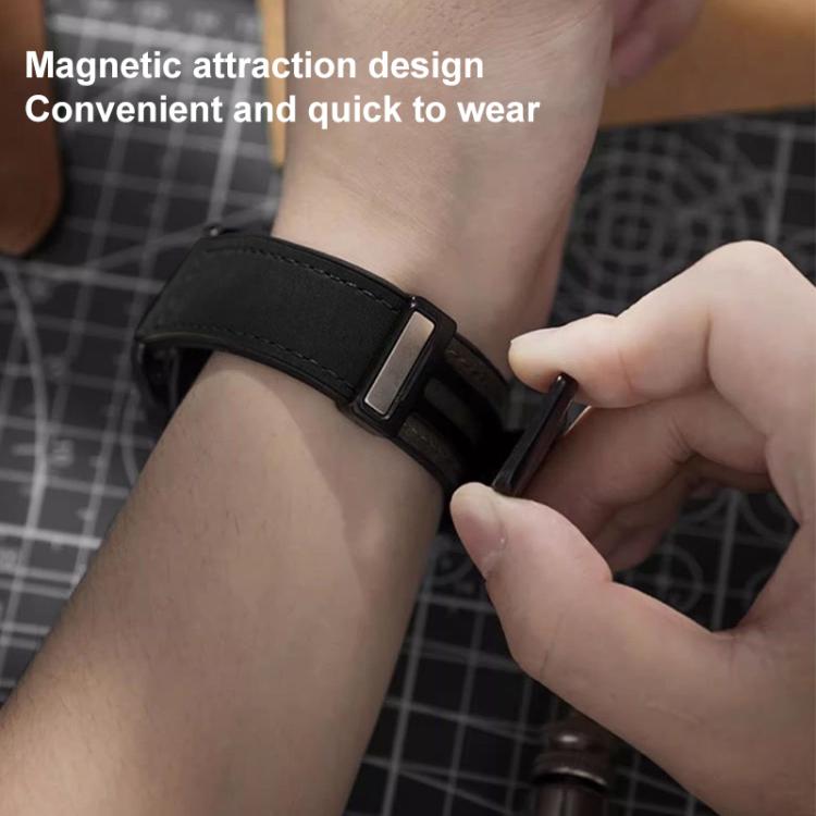 Black silicone watch band fastened around a wrist with its magnetic buckle