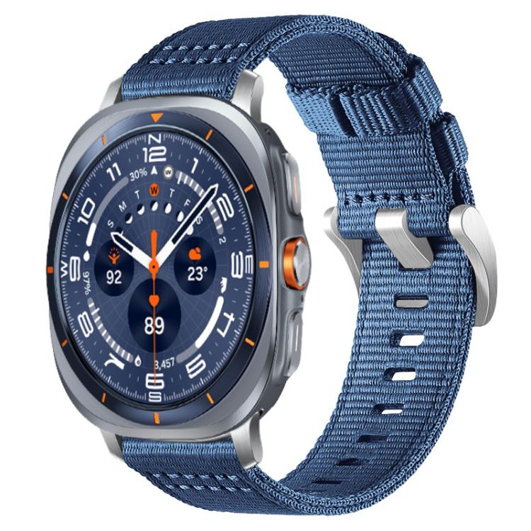 Blue two-section nylon watch band with metal hooks, shown on a silver smartwatch