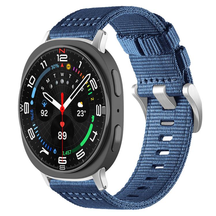 Blue two-section nylon watch band with metal hooks, shown on a dark smartwatch