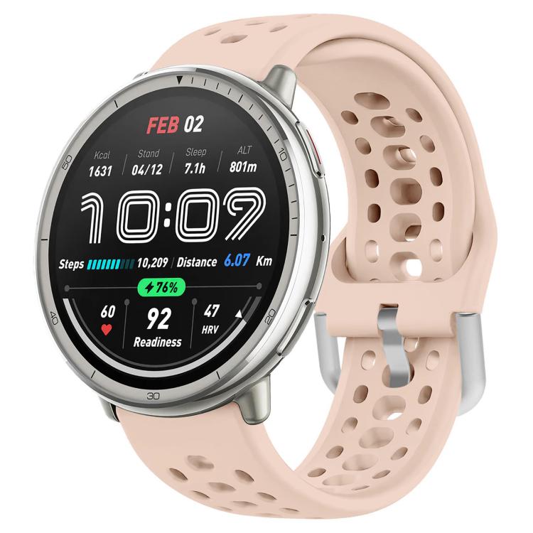 Pale pink perforated silicone sport watch band fitted to a silver smartwatch